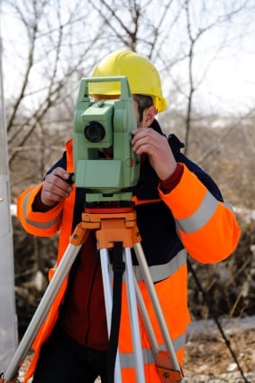 Land Surveyor Working on a Survey